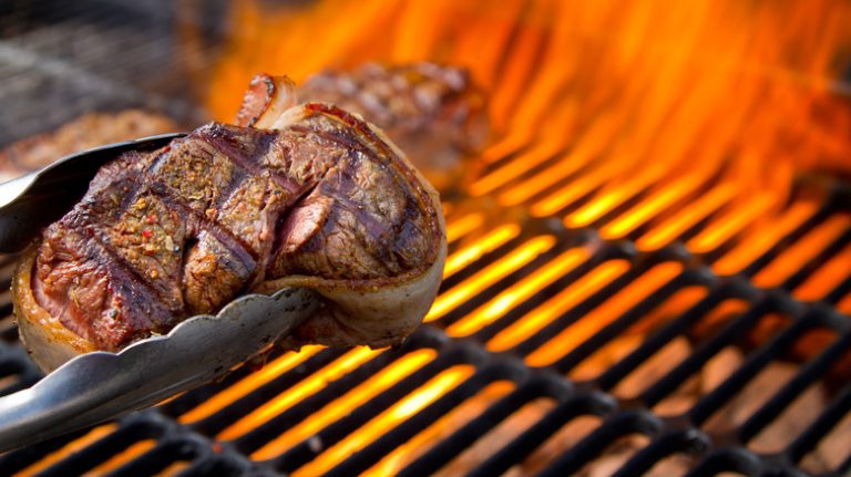 seared steak on grill