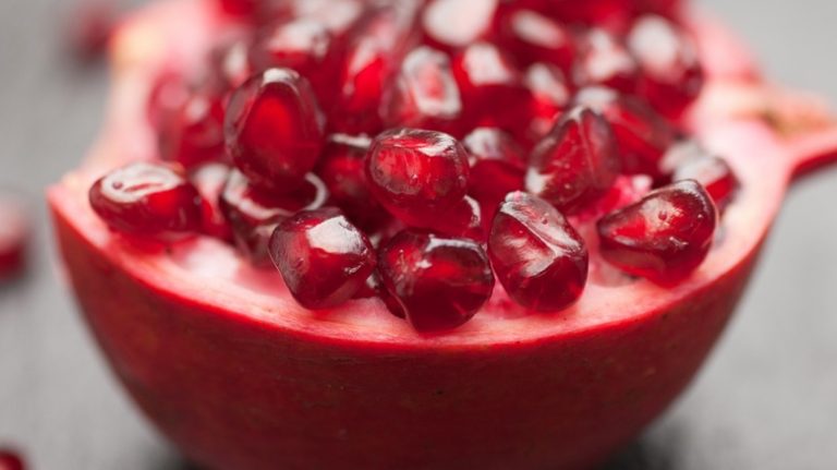 Close-up of arils in a split open pomegranate