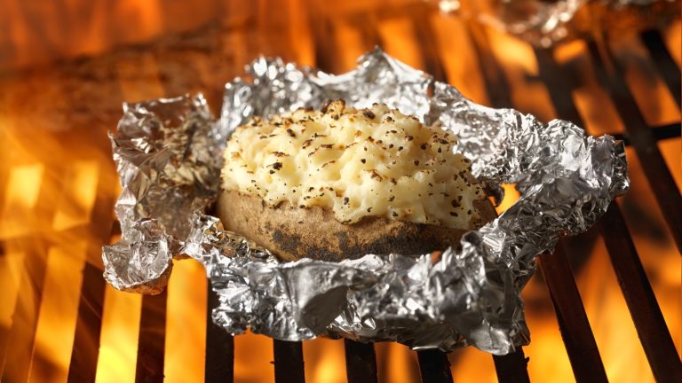 https://www.tastingtable.com/1592745/grilling-baked-potatoes-salt-crust/