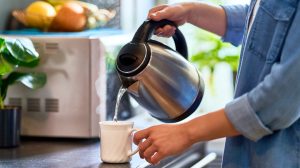 Pouring into mug from electric kettle