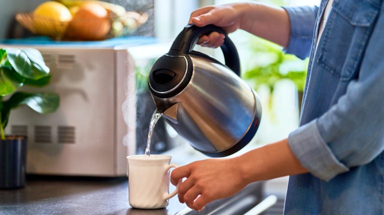 Pouring into mug from electric kettle