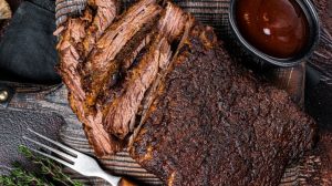 Top-down view of smoked steak with BBQ sauce