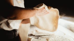 https://www.tastingtable.com/1549405/how-to-throw-pizza-dough-without-tearing/