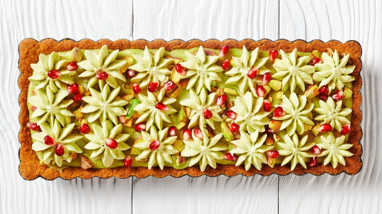 Pistachio ganache tart on rectangular tin