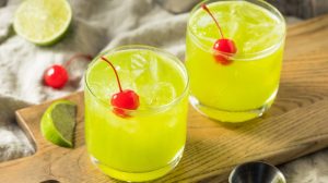 Midori sours with cherry garnish