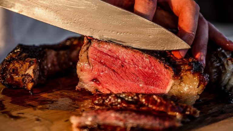 Steak sliced with knife